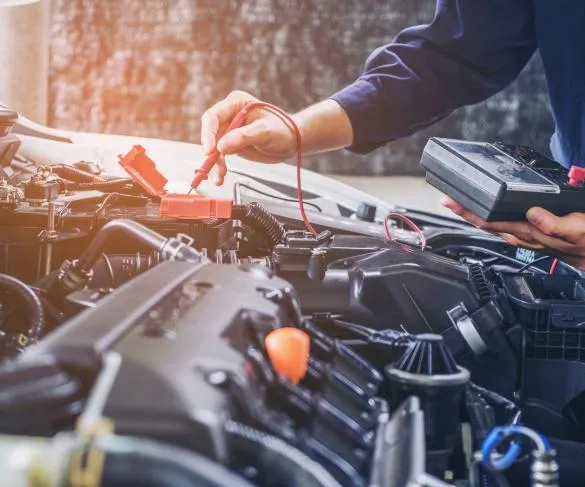 Mechanic testing electricals