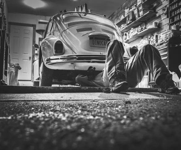 Mechanic working on vintage car