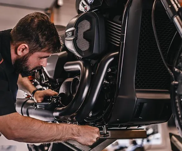 Motor trader working on car