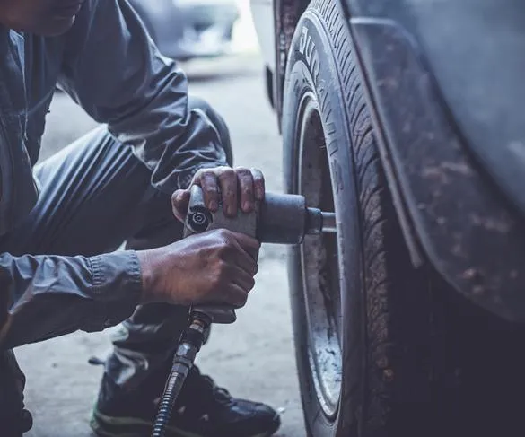 Mechanic fixing tyre