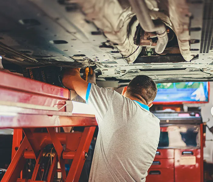 mechanic working on car